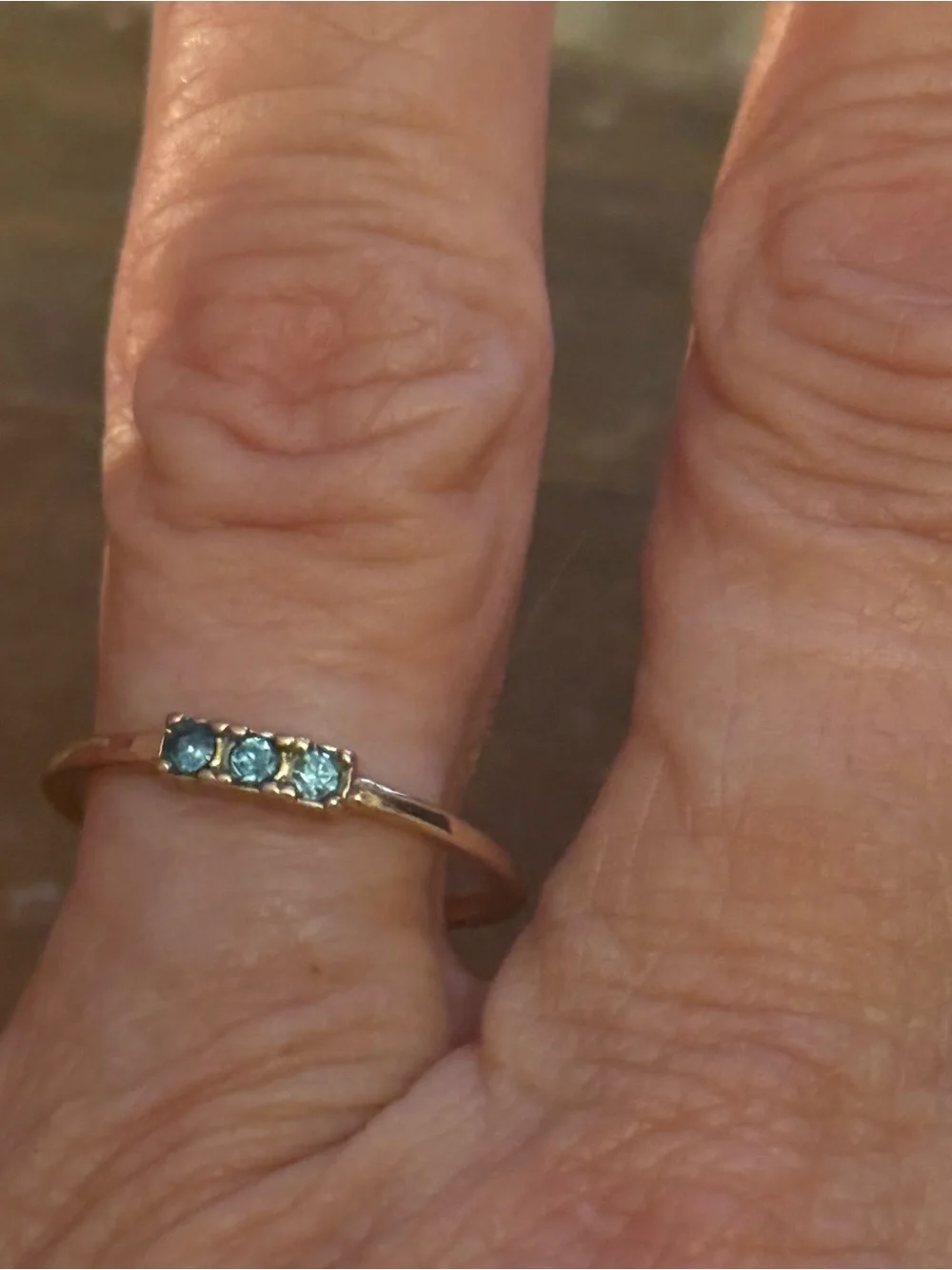 Dainty gold tone triple bezel set aquamarine ring